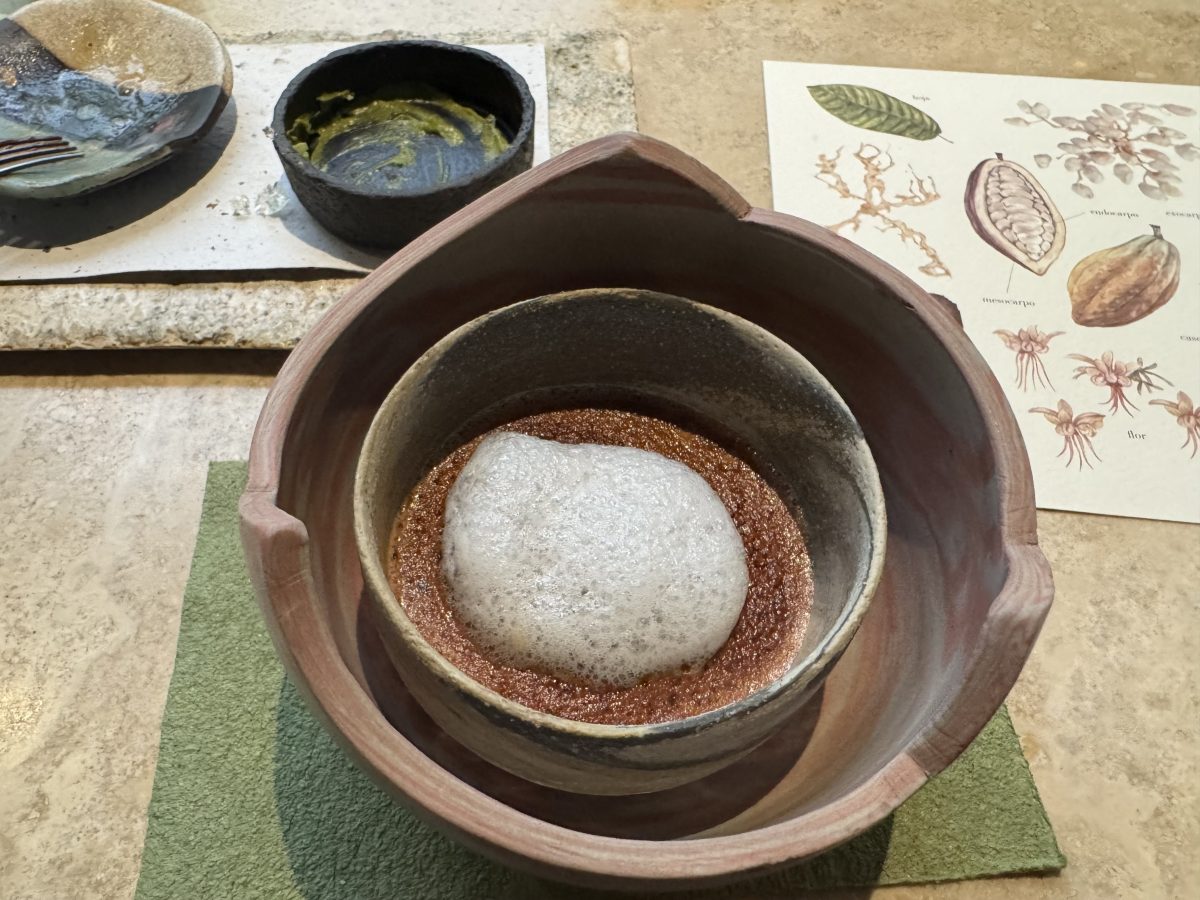 Cacao Chuncho: A rich and immersive dessert experience at 1,800 meters above sea level, showcasing Mucilago, Semillas, and Cáscara of cacao. This dish celebrates the full complexity of Peruvian cacao, offering an intense and earthy flavor profile that honors the essence of chocolate in its purest form.